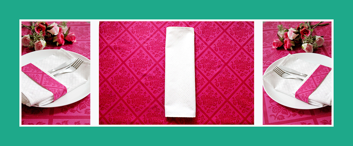 Weisse Stoffserviette mit rosa Bändchen falten Weisse Stoffserviette mit rosa Bändchen falten