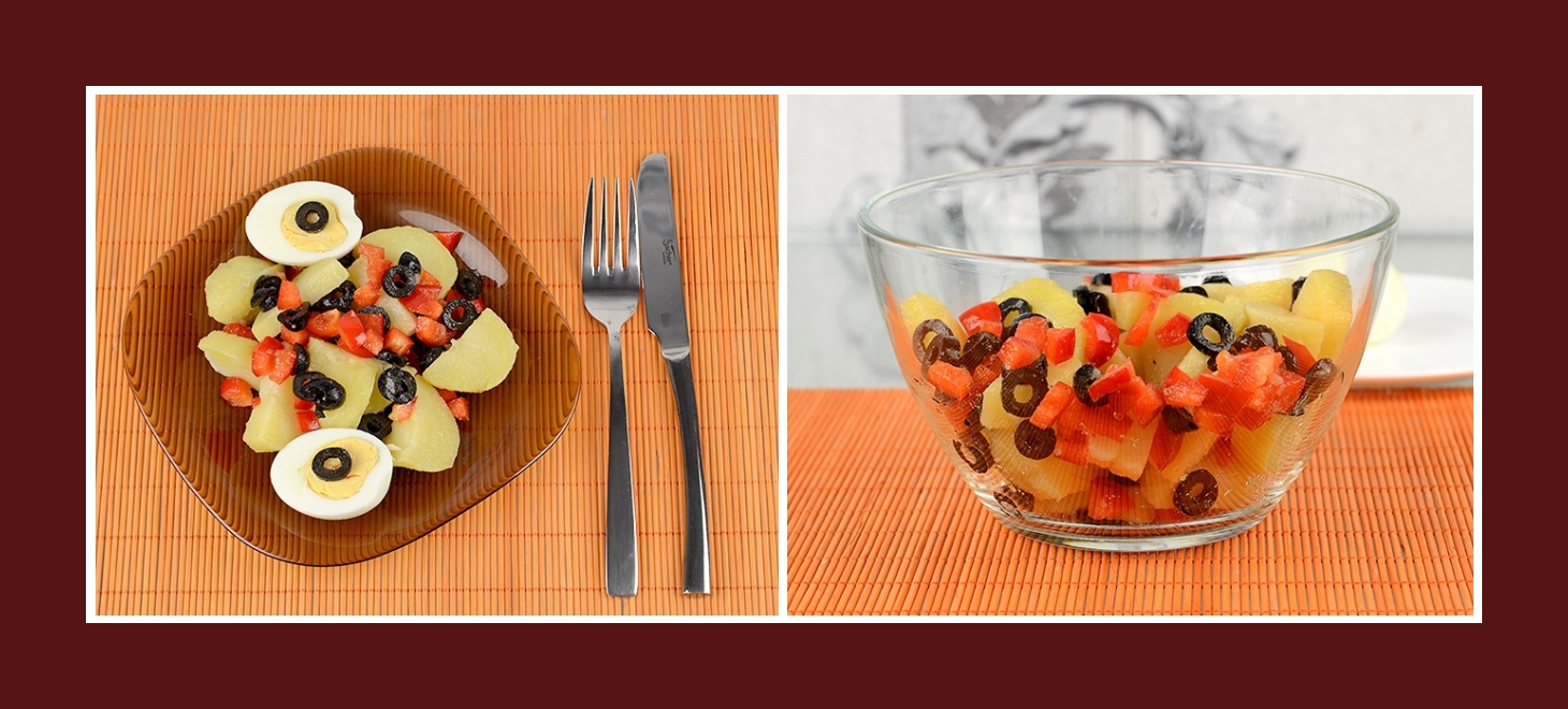 Kartoffelsalat mit schwarzen Oliven und roter Paprika